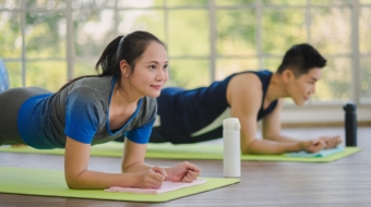 Adult asian man and woman family wearing sport outfit do exercise workout yoga for healthy self care at home